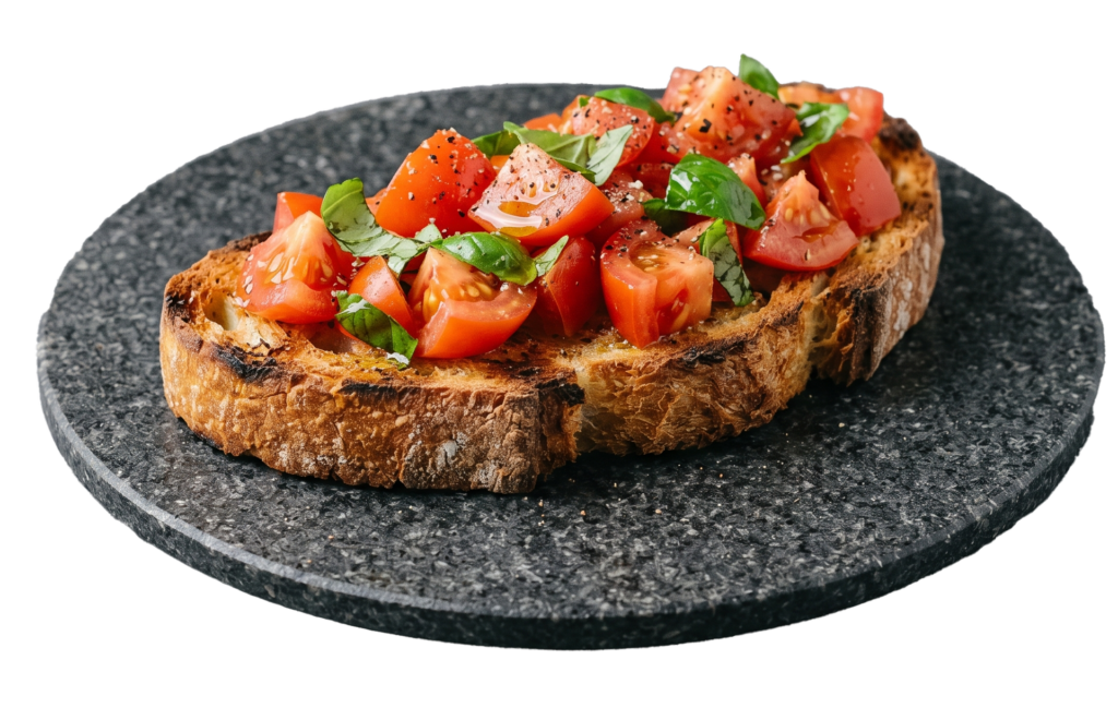 Geröstetes Weißbrot mit frischen Tomatenstücken, Basilikum und Gewürzen auf dunklem Stein, als Bruschetta al Pomodoro serviert.